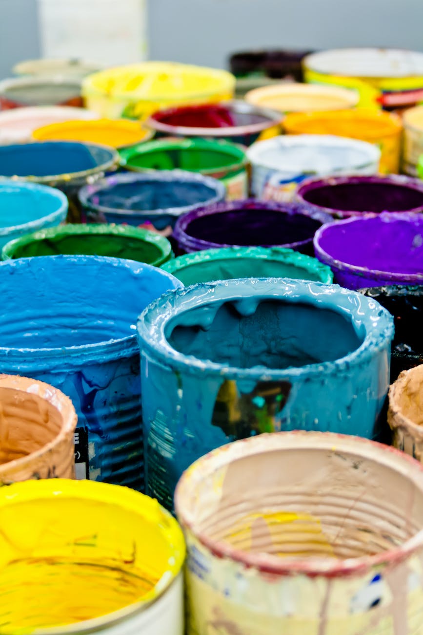 assorted color paint buckets