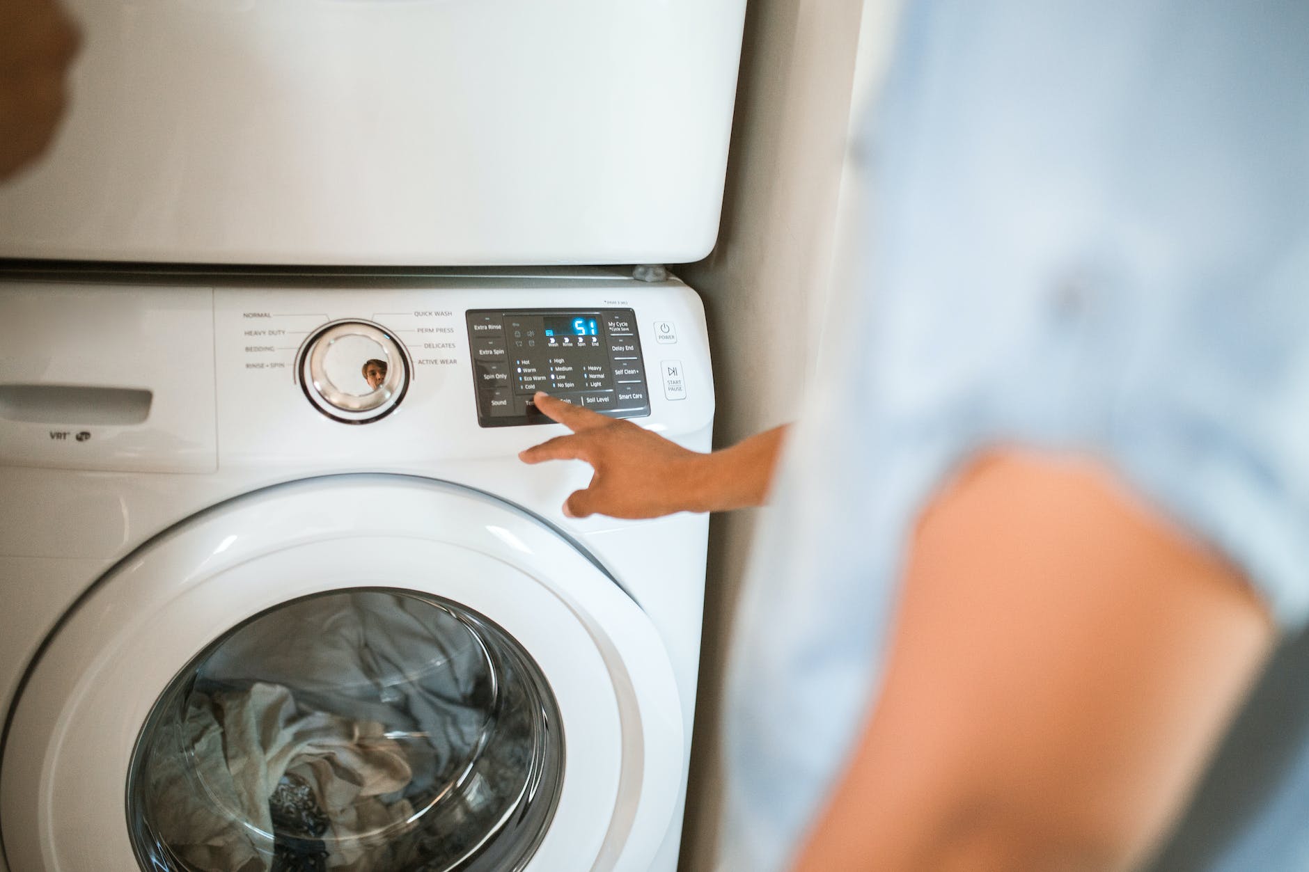 person using washing machine